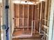 Unfinished shower with orange colored base and visible studs, and exposed plumbing at 15447 Hamlin Park Drive, Winter Garden, FL 34787