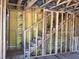 Wooden staircase framed inside the house showcasing its sturdy structure and design during construction at 15447 Hamlin Park Drive, Winter Garden, FL 34787