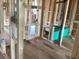 A partially finished room showcases a modern tub with black plumbing and framing at 15447 Hamlin Park Drive, Winter Garden, FL 34787