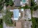 Drone view of the property highlighting the home's metal roof and the surrounding landscape at 160 Chestnut Ave, Orange City, FL 32763