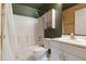 Functional bathroom with a shower-tub combo, white vanity, and tiled floors at 160 Chestnut Ave, Orange City, FL 32763