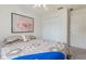Well-lit bedroom featuring a bed with decorative pillows and a large, closet doors at 160 Chestnut Ave, Orange City, FL 32763