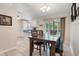 Dining area features tiled floors and natural light from sliding glass door to the screened patio at 160 Chestnut Ave, Orange City, FL 32763