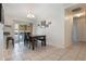 Bright dining area with view of screened patio and tiled flooring throughout at 160 Chestnut Ave, Orange City, FL 32763