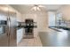 Well-lit kitchen features stainless steel appliances and white cabinetry at 160 Chestnut Ave, Orange City, FL 32763