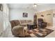 Comfortable living room featuring plush furniture, a ceiling fan, and tile flooring at 160 Chestnut Ave, Orange City, FL 32763