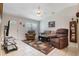 Spacious living room featuring neutral furniture, tile floors, and a ceiling fan at 160 Chestnut Ave, Orange City, FL 32763