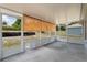 Spacious screened-in patio with exterior view to the backyard and a doggie door at 160 Chestnut Ave, Orange City, FL 32763