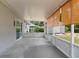 Large screened patio perfect for outdoor living with view of the backyard at 160 Chestnut Ave, Orange City, FL 32763