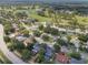 Idyllic aerial view of a residential neighborhood with lush green landscaping and community recreational spaces at 1633 Pinehurst Dr, Casselberry, FL 32707
