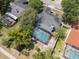 Aerial shot of the property featuring a screened-in pool and lush landscaping at 1633 Pinehurst Dr, Casselberry, FL 32707