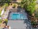 Aerial shot of the screened-in pool and hot tub in the backyard at 1633 Pinehurst Dr, Casselberry, FL 32707