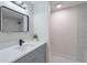 Tastefully remodeled bathroom with a gray vanity, marble accents and modern hardware at 1633 Pinehurst Dr, Casselberry, FL 32707