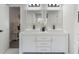 Elegant bathroom boasts double vanity, black fixtures, and a view into the bright shower at 1633 Pinehurst Dr, Casselberry, FL 32707