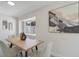 Dining room with modern art, a stylish table and chairs set, and a view to the exterior at 1633 Pinehurst Dr, Casselberry, FL 32707