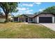 Charming single-story home with a well-maintained lawn and attached two-car garage at 1633 Pinehurst Dr, Casselberry, FL 32707