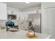 Updated kitchen featuring white cabinetry, stainless steel appliances, and quartz countertops at 1633 Pinehurst Dr, Casselberry, FL 32707