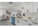 Bright, updated kitchen with white cabinets, modern appliances, and an open view to the living area at 1633 Pinehurst Dr, Casselberry, FL 32707