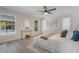 Serene main bedroom featuring a view of the pool and natural light, creating a relaxing atmosphere at 1633 Pinehurst Dr, Casselberry, FL 32707