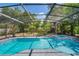 View of the sparkling pool and hot tub inside screened enclosure at 1633 Pinehurst Dr, Casselberry, FL 32707