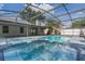 Enclosed pool and deck area are accessed from the house through sliding glass doors at 1633 Pinehurst Dr, Casselberry, FL 32707