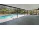 Screened-in pool with an attached hot tub and spacious deck at 1633 Pinehurst Dr, Casselberry, FL 32707