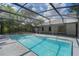 Enclosed pool and deck area are accessed from the house through sliding glass doors at 1633 Pinehurst Dr, Casselberry, FL 32707