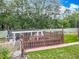 Backyard chicken coop and garden with mature trees at 19123 Sheldon St, Orlando, FL 32833