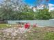 A backyard fire pit with chairs offers an inviting outdoor relaxation space at 19123 Sheldon St, Orlando, FL 32833
