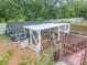 Exterior view of backyard featuring aquaponics setup and mature trees at 19123 Sheldon St, Orlando, FL 32833