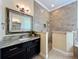 Bathroom featuring vanity, walk-in shower, and soaking tub at 19123 Sheldon St, Orlando, FL 32833