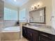 Bright bathroom featuring soaking tub and vanity at 19123 Sheldon St, Orlando, FL 32833