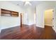 Spacious bedroom with hardwood floors, multiple doorways, and ceiling fan at 19123 Sheldon St, Orlando, FL 32833