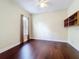 Cozy bedroom featuring hardwood floors, natural light, and a ceiling fan at 19123 Sheldon St, Orlando, FL 32833