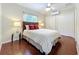 Serene bedroom with hardwood floors, a comfortable bed, and plenty of closet space for a peaceful retreat at 19123 Sheldon St, Orlando, FL 32833