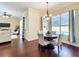 A dining area offering views of the pool, seamlessly connected to the living room and kitchen at 19123 Sheldon St, Orlando, FL 32833