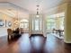 Spacious foyer with gleaming hardwood floors leads to the dining room and office, showcasing the home's elegant design at 19123 Sheldon St, Orlando, FL 32833