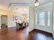 Elegant foyer entrance with hardwood floors with a beautiful dining room, perfect for hosting gatherings at 19123 Sheldon St, Orlando, FL 32833