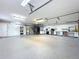 Expansive garage with ample storage, custom workbenches, and high ceilings, offering space for projects and vehicles at 19123 Sheldon St, Orlando, FL 32833