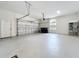 Spacious and well-lit garage with high ceilings, shelving, and exterior door at 19123 Sheldon St, Orlando, FL 32833