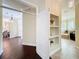 Elegant hallway with display shelves leading to the dining and bathroom areas at 19123 Sheldon St, Orlando, FL 32833
