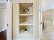 Hallway featuring display shelves and access to the bathroom at 19123 Sheldon St, Orlando, FL 32833