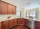 Detailed kitchen with granite countertops, wood cabinets, and stainless steel appliances at 19123 Sheldon St, Orlando, FL 32833