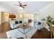 Inviting living room with plush seating, stylish decor, and seamless flow to the dining and kitchen areas at 19123 Sheldon St, Orlando, FL 32833