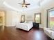 Spacious main bedroom with tray ceilings, hardwood floors, and ample natural light at 19123 Sheldon St, Orlando, FL 32833