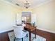 The office provides the perfect work environment with a comfortable chair, desk and decor at 19123 Sheldon St, Orlando, FL 32833