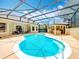 Backyard pool with screened enclosure and outdoor kitchen at 19123 Sheldon St, Orlando, FL 32833