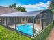 Screened-in pool area featuring turquoise pool and landscaped surroundings at 19123 Sheldon St, Orlando, FL 32833