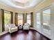 Bright sitting room featuring hardwood floors and an outdoor view of the pool at 19123 Sheldon St, Orlando, FL 32833
