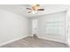 Bright, airy bedroom features a ceiling fan, closet, and sliding glass doors to a balcony at 1932 Lake Atriums Cir # 69, Orlando, FL 32839